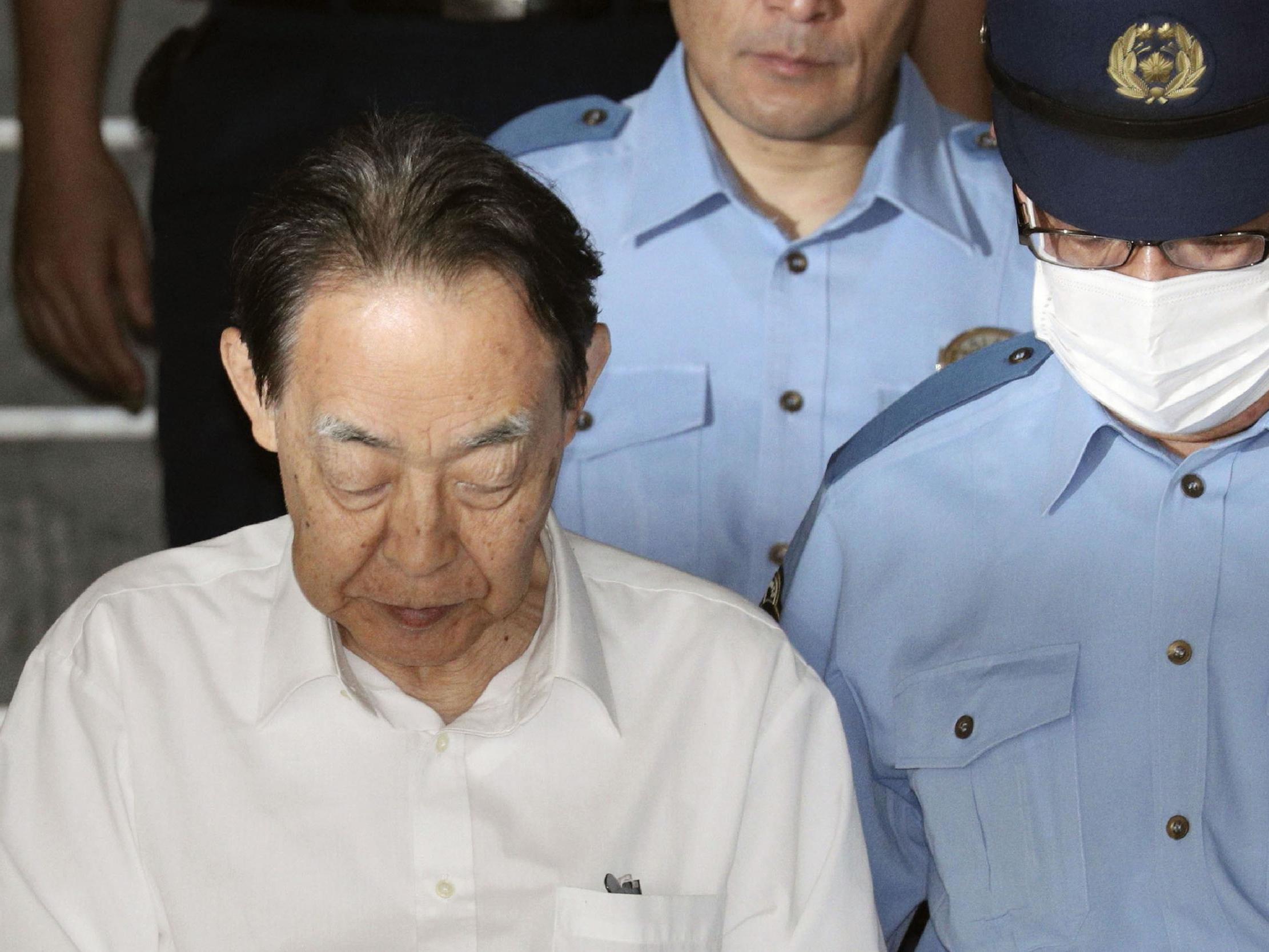 Hideaki Kumazawa leaves a police station in Tokyo earlier this year