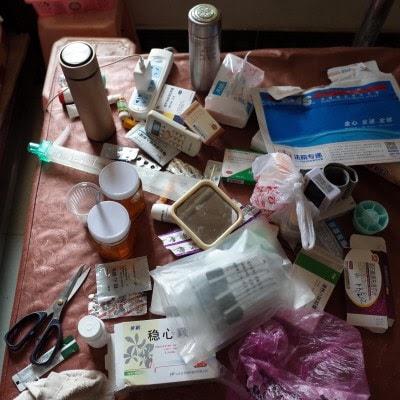 Wang Quanlong’s home is filled with stacks of medicines and oxygen bags to relieve symptoms of pneumoconiosis. The disease is incurable and often leads to a slow, painful death (Washington Post/Gerry Shih)