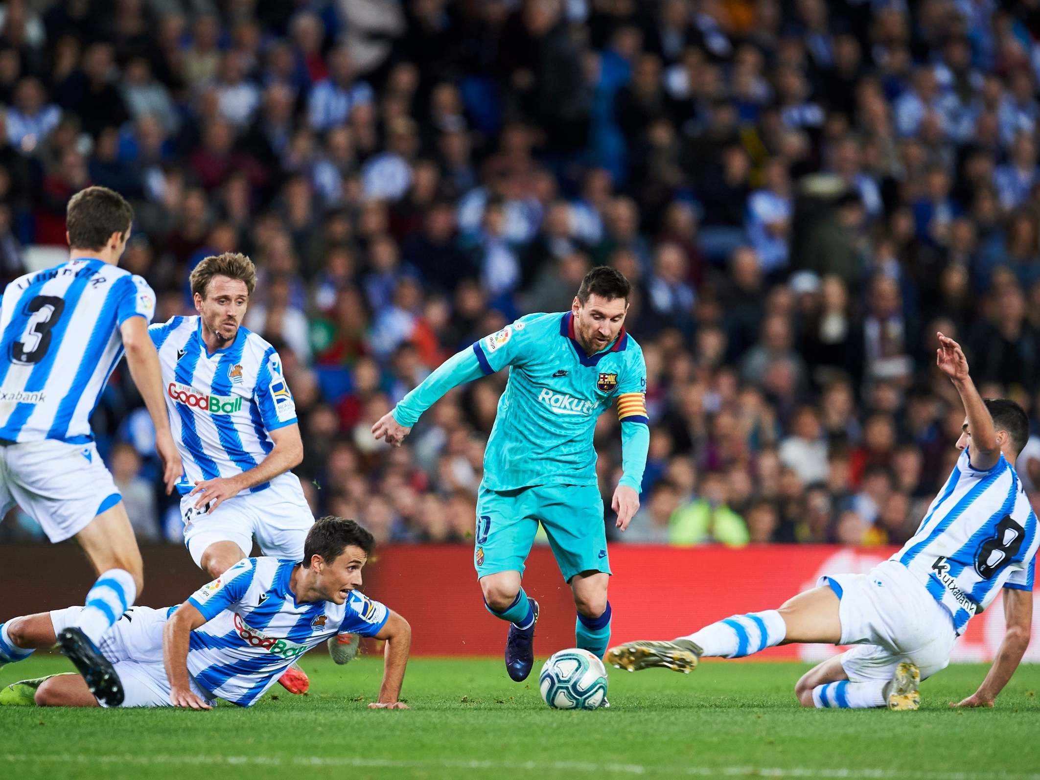 Lionel Messi dribbles at the Sociedad defence