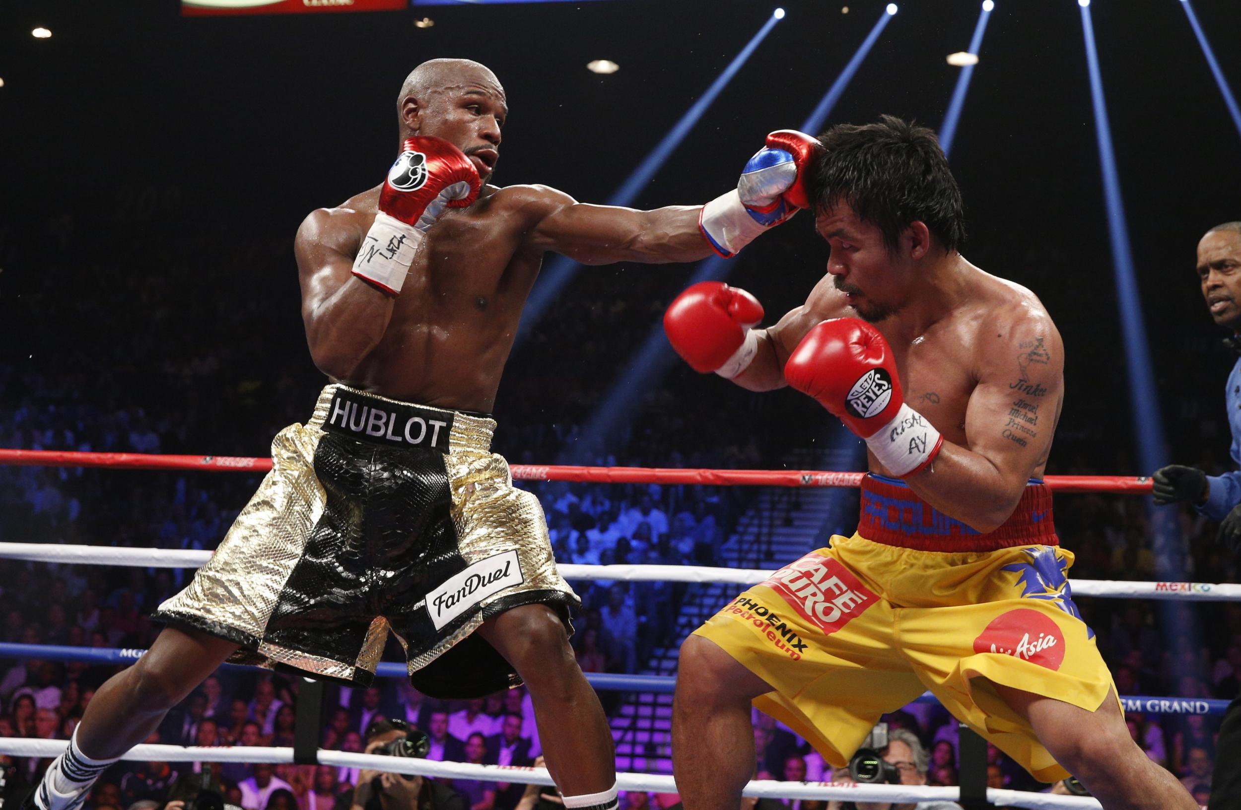 Floyd Mayweather (left) takes on Pacquiao in 2015