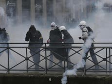 Tear gas fired at France protesters as thousands lose electricity 