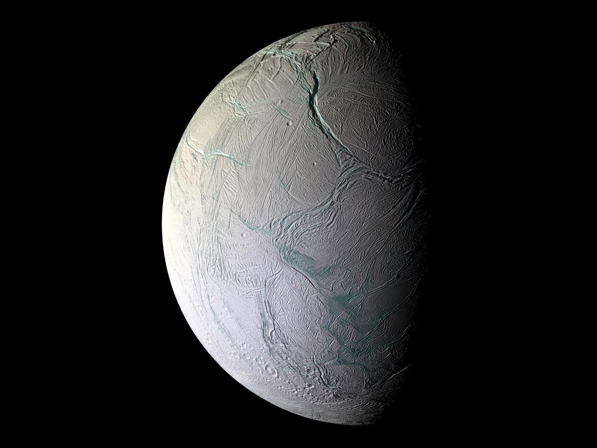 Enceladus blasts salty water into space through cracks in its shell