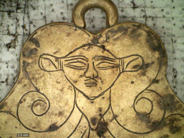 A golden pendant of the Egyptian goddess Hathor found in a 3,500-year-old tomb in southern Greece