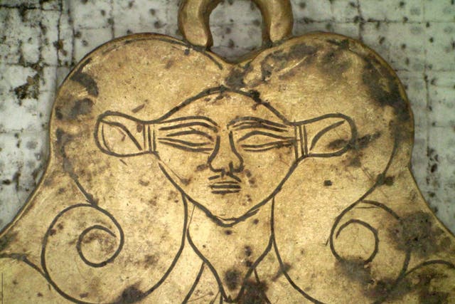A golden pendant of the Egyptian goddess Hathor found in a 3,500-year-old tomb in southern Greece