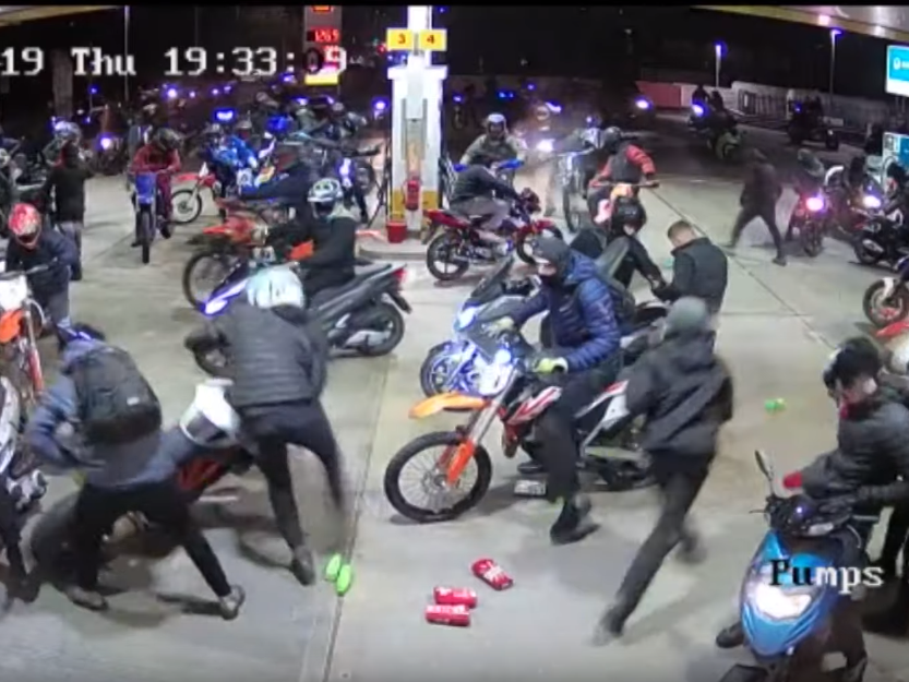 Dozens of masked men on motorbikes ransack Manchester petrol station in &apos;large scale public disorder&apos;