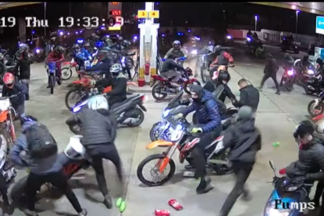 Police released footage of motorcyclists causing 'large scale public disorder' at a Manchester petrol station