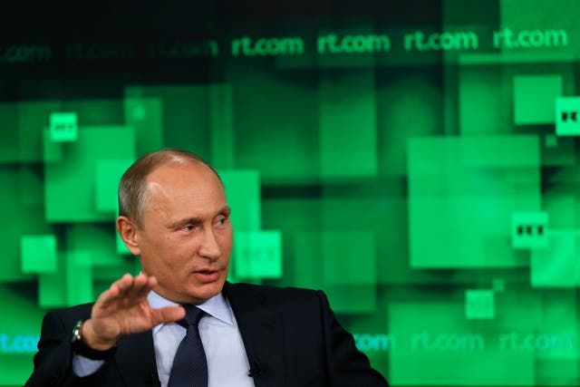 <p>President Vladimir Putin speaks during his visit to the new studio complex of the state-owned English-language Russia Today television network in Moscow, on June 11, 2013</p>