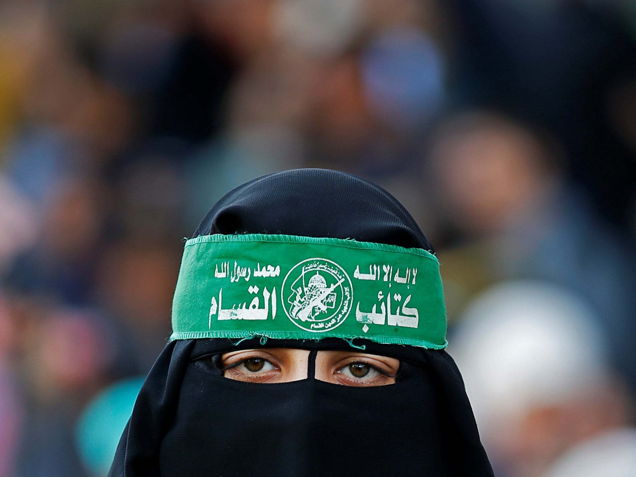 Gaza City: a Palestinian takes part in a rally on Saturday marking the 32nd anniversary of the founding of Hamas
