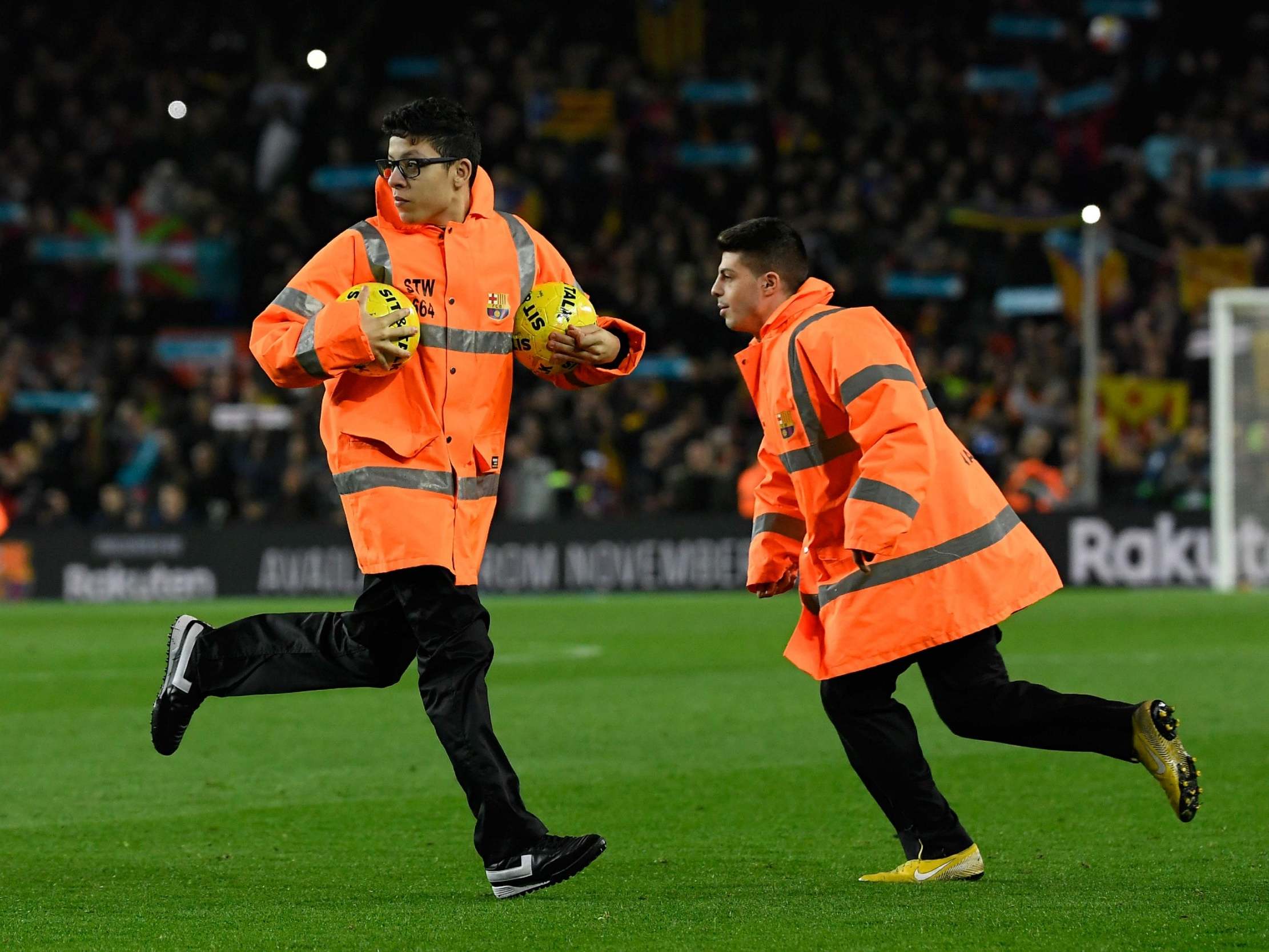 Protesters forced the Clasico to be temporarily halted by throwing balls onto the pitch
