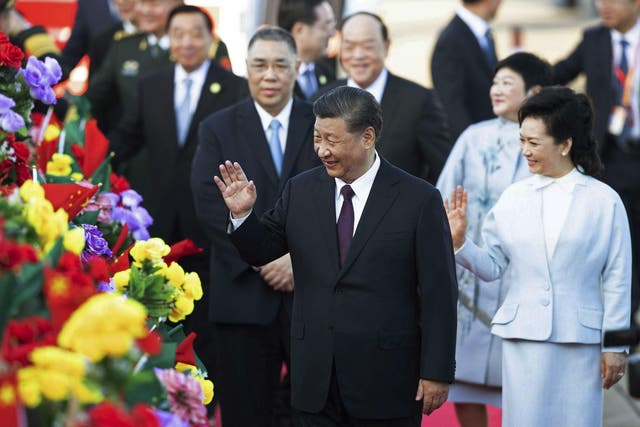 Chinese president Xi Jinping and his wife Peng Liyuan arrive at Macau airport
