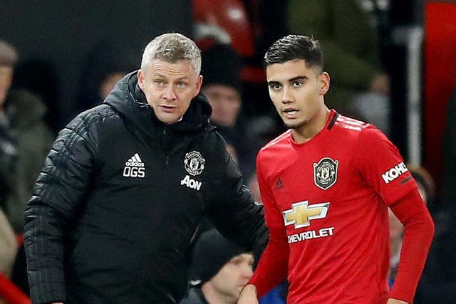Manchester United manager Ole Gunnar Solskjaer speaks with Andreas Pereira