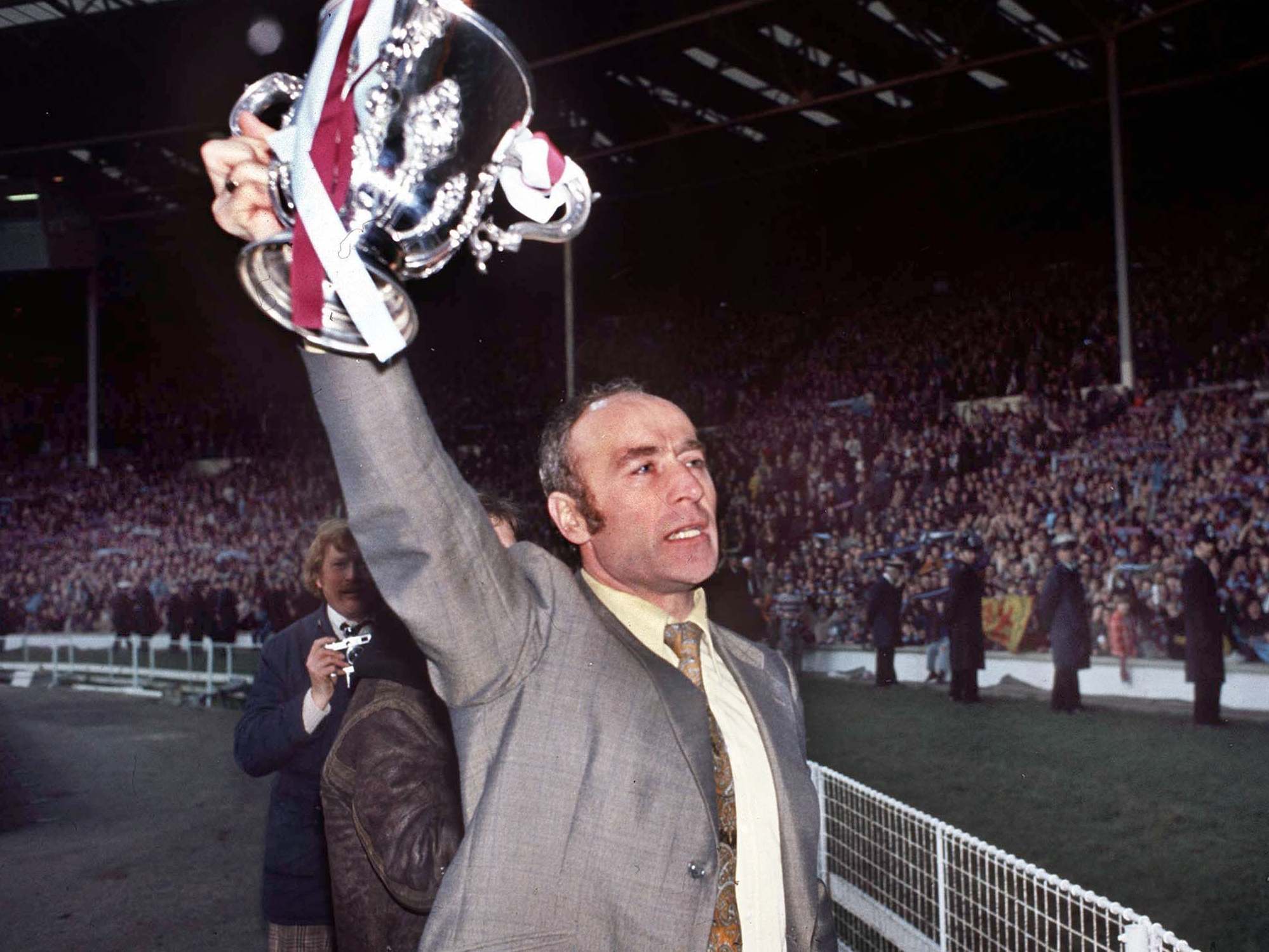 Saunders holds aloft the League Cup at Wembley after Villa’s win over Norwich in the 1975 final