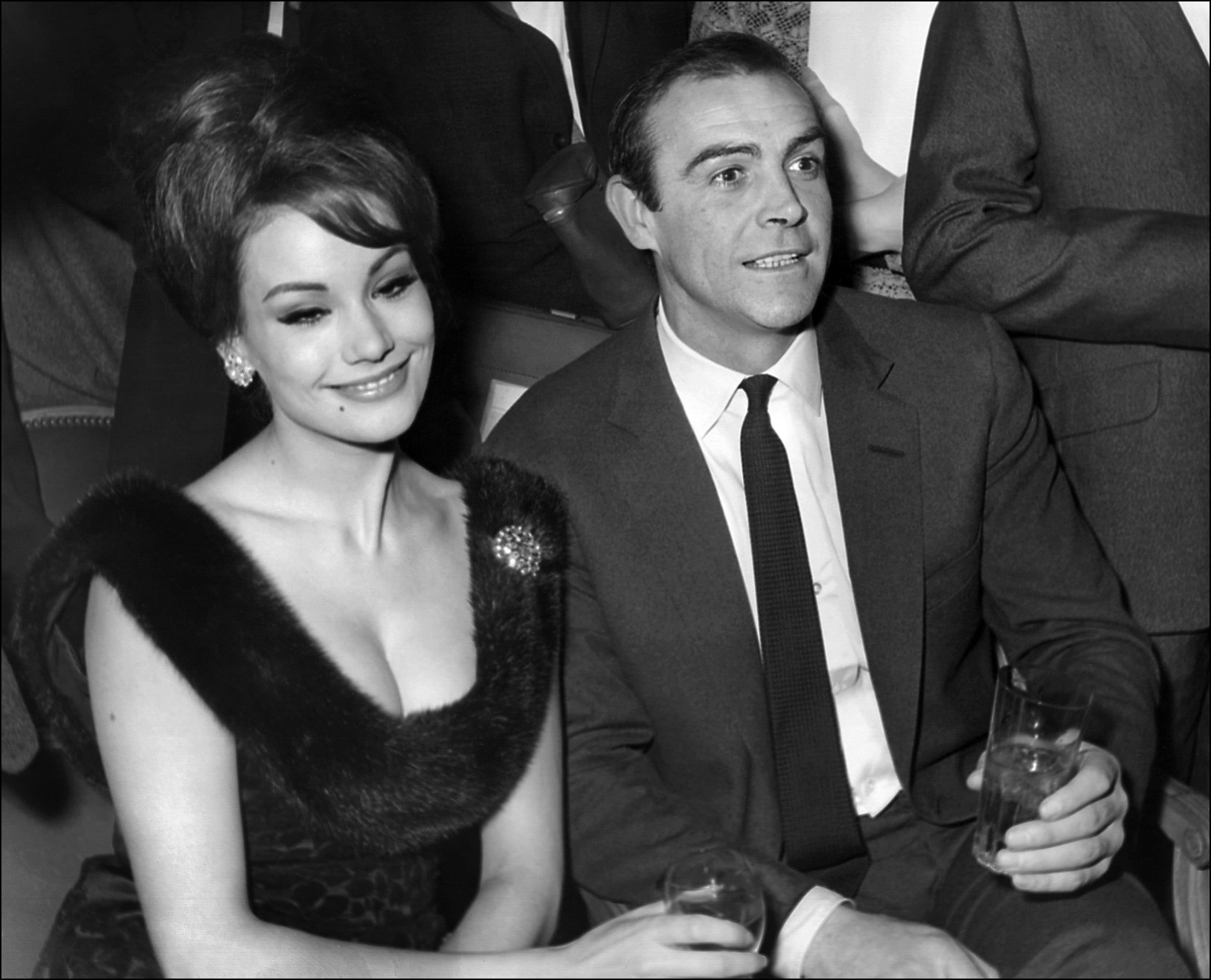 Claudine Auger with co-star Sean Connery at a press conference for 'Thunderball' in Paris, 1965