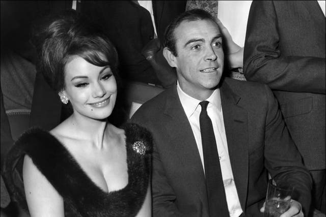 Claudine Auger with co-star Sean Connery at a press conference for 'Thunderball' in Paris, 1965