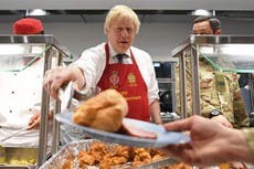 Johnson serves Christmas dinner to British troops in Estonia