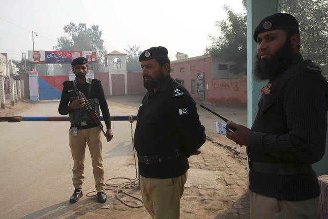 Pakistani police officers stand guard outside Multan jail where former university lecturer Junaid Hafeez was convicted of blasphemy and sentenced to the death penalty, 21 December, 2019.