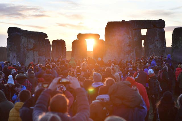 People gather at Stonehenge in Wiltshire to mark the winter solstice