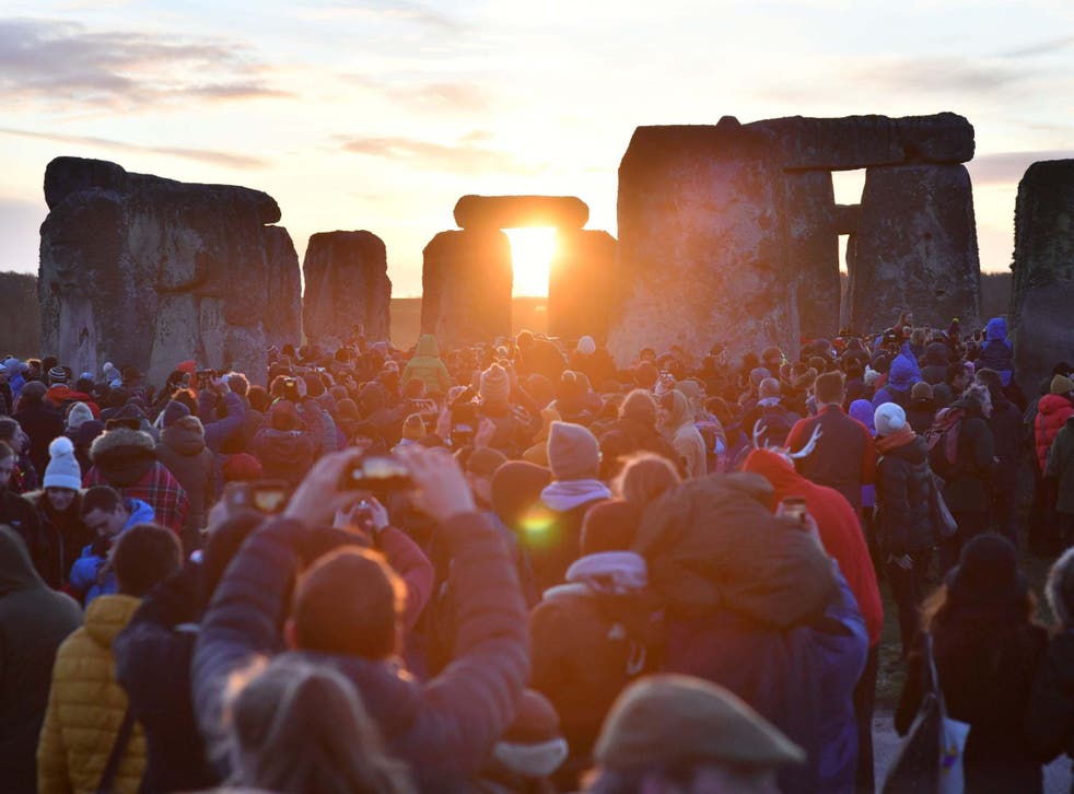 People gather at Stonehenge in Wiltshire to mark the winter solstice