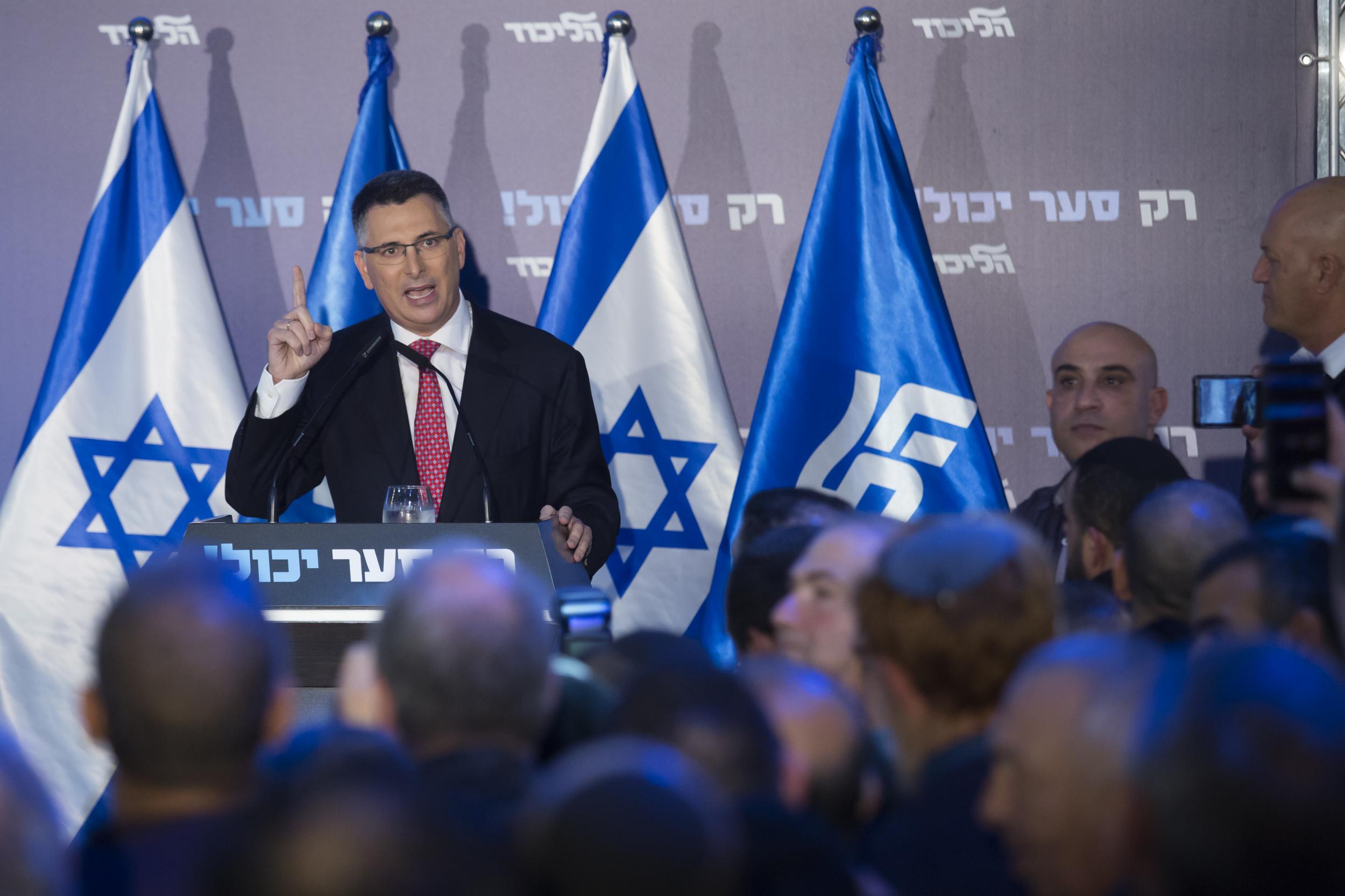 Gideon Saar, Likud Party member, speaks at a campaign rally in Or Yehuda ahead of party primaries (Getty)
