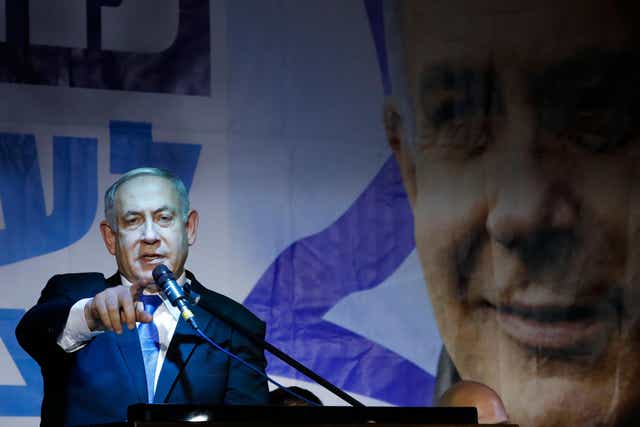Israeli Prime Minister Benjamin Netanyahu addresses Likud party supporters during an electoral meeting in the Israeli city of Petah Tikva near Tel Aviv