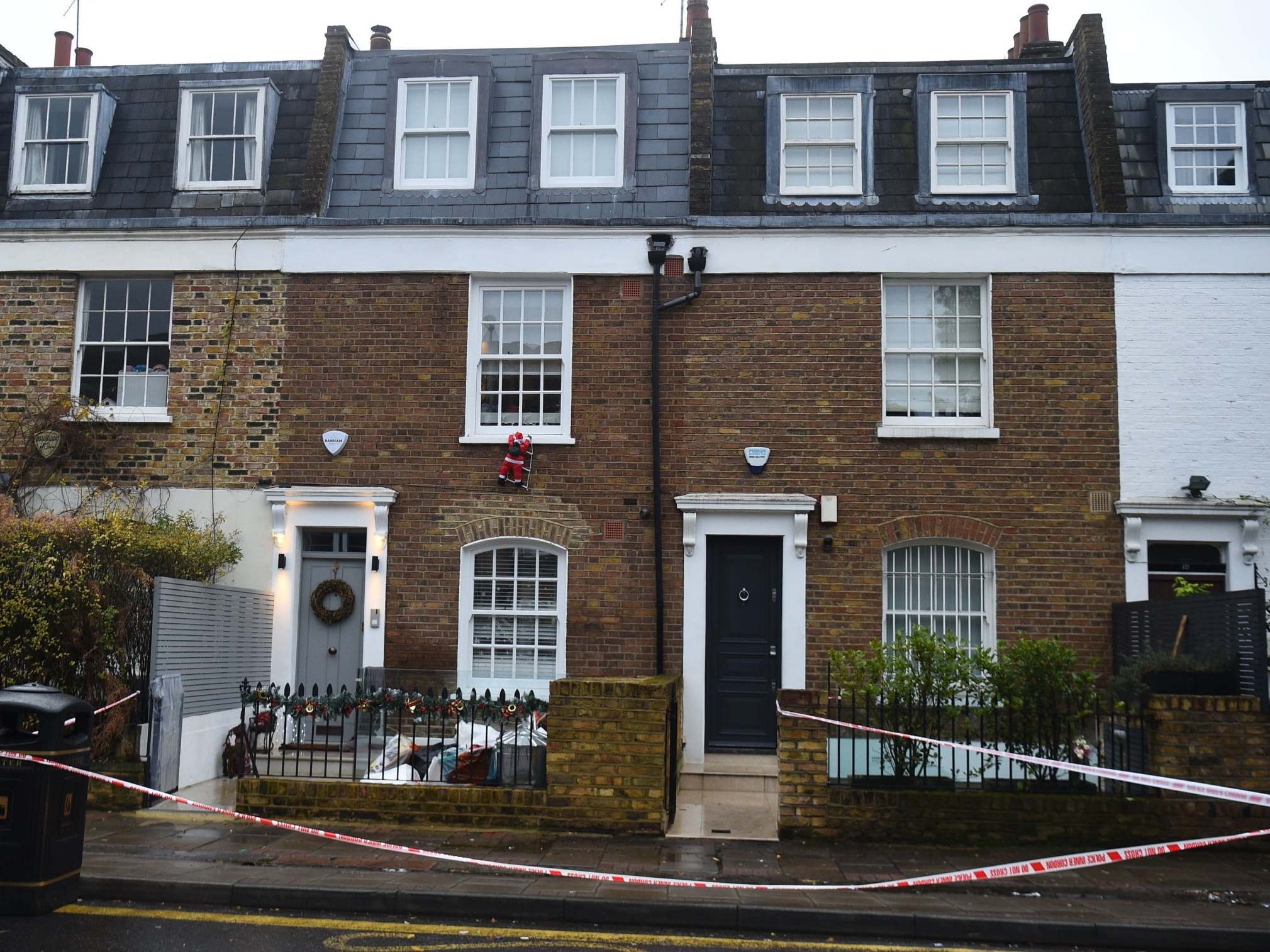 Police tape in Battersea Church Road, south London following an incident where a man was shot dead on Tuesday