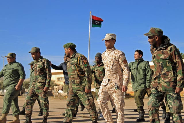 Fighters of a military battalion loyal to Libyan General Khalifa Haftar march during the morning assembly in the eastern city of Benghazi on 18 December 18 2019