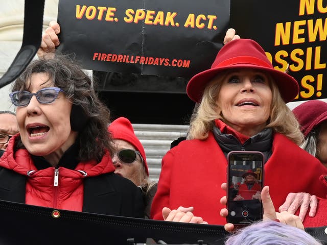 Actors and activists Lily Tomlin and Jane Fonda lead a climate protest on the steps of the US Capitol in Washington, DC on 27 December 2019