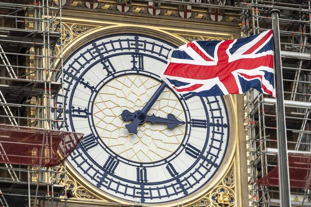 The Union flag flies in front of the Clock face on the Queen Elizabeth Tower, commonly referred to as Big Ben