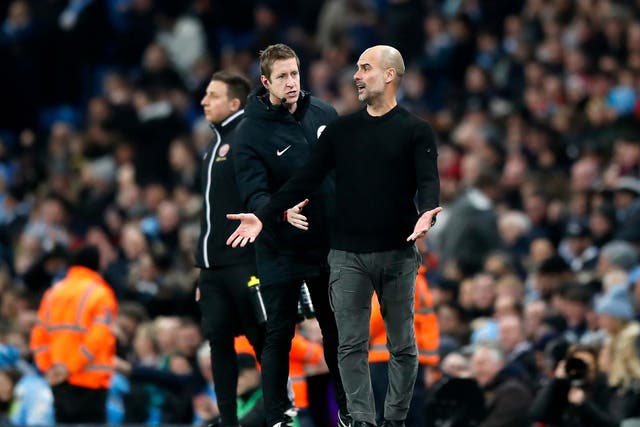 Pep Guardiola gestures on the touchline