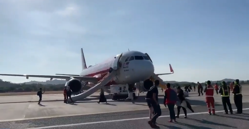 Plane deploys evacuation slides after emergency landing