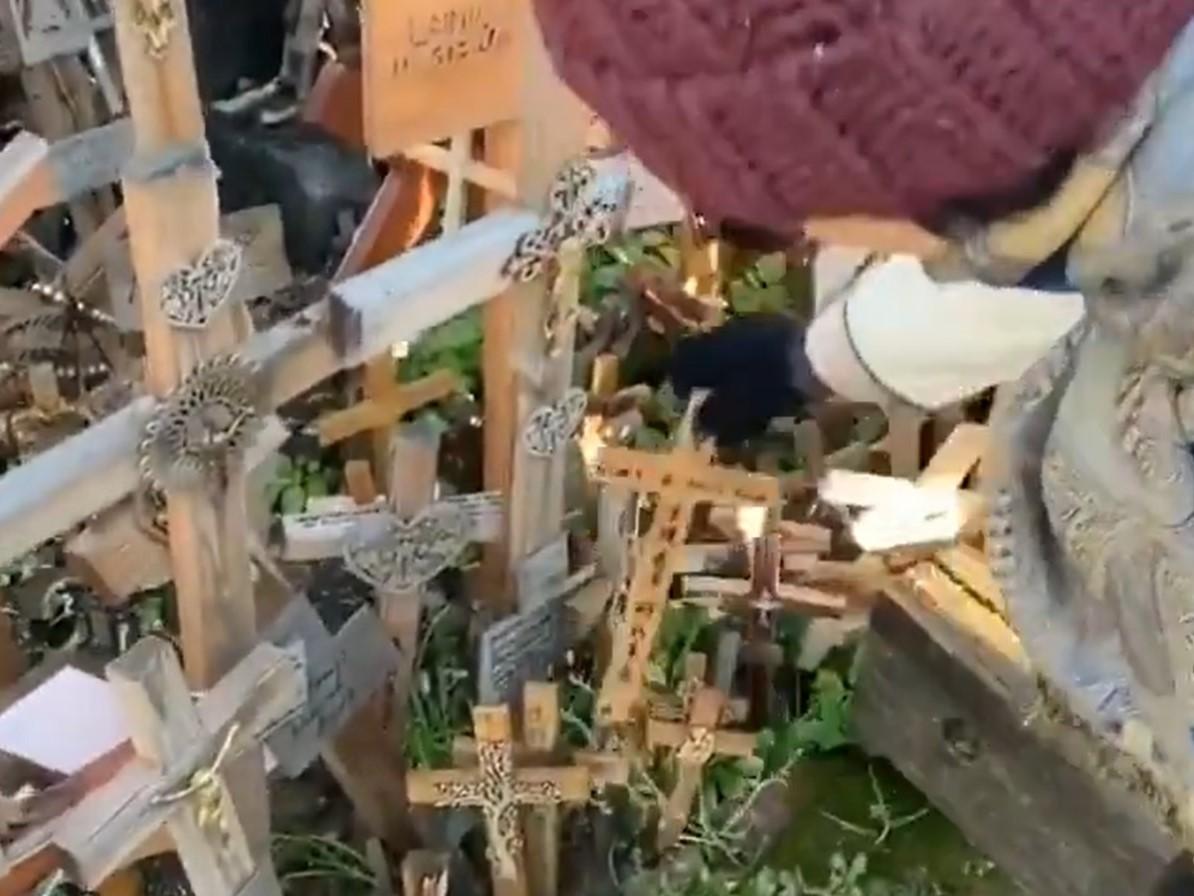 Hunt for Chinese tourist who &apos;vandalised&apos; sacred religious site in Eurospe to remove message of support for Hong Kong protests