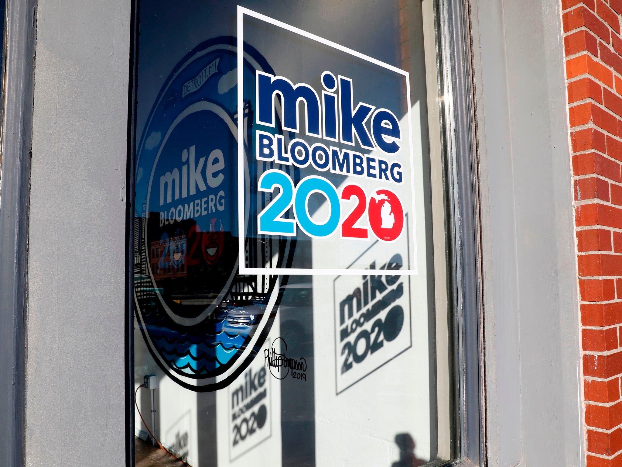 A sign in the window seen at a campaign office at Eastern Market in Detroit, Michigan