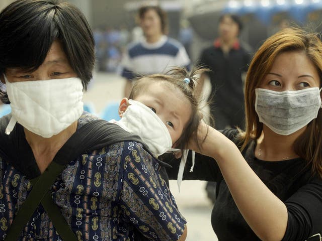 People wore face masks in 2003 to try to avoid catching Sars as it spread rapidly