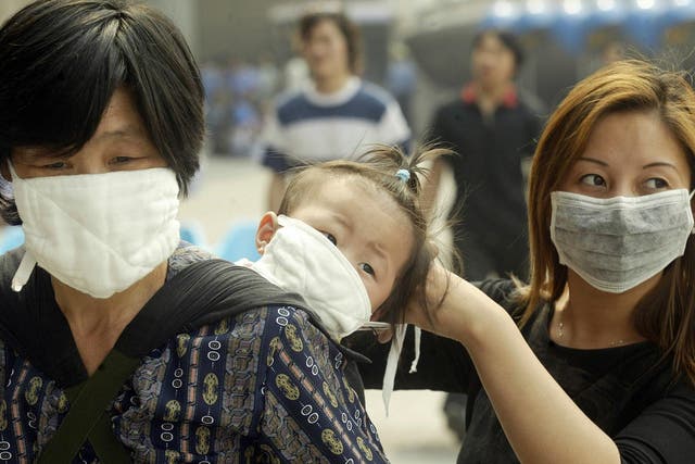 People wore face masks in 2003 to try to avoid catching Sars as it spread rapidly