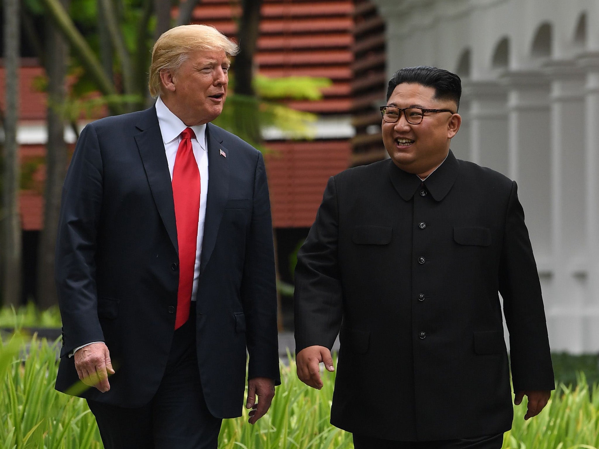 Trump and Kim take a stroll during a break in talks at the Capella in Singapore on 12 June 2018