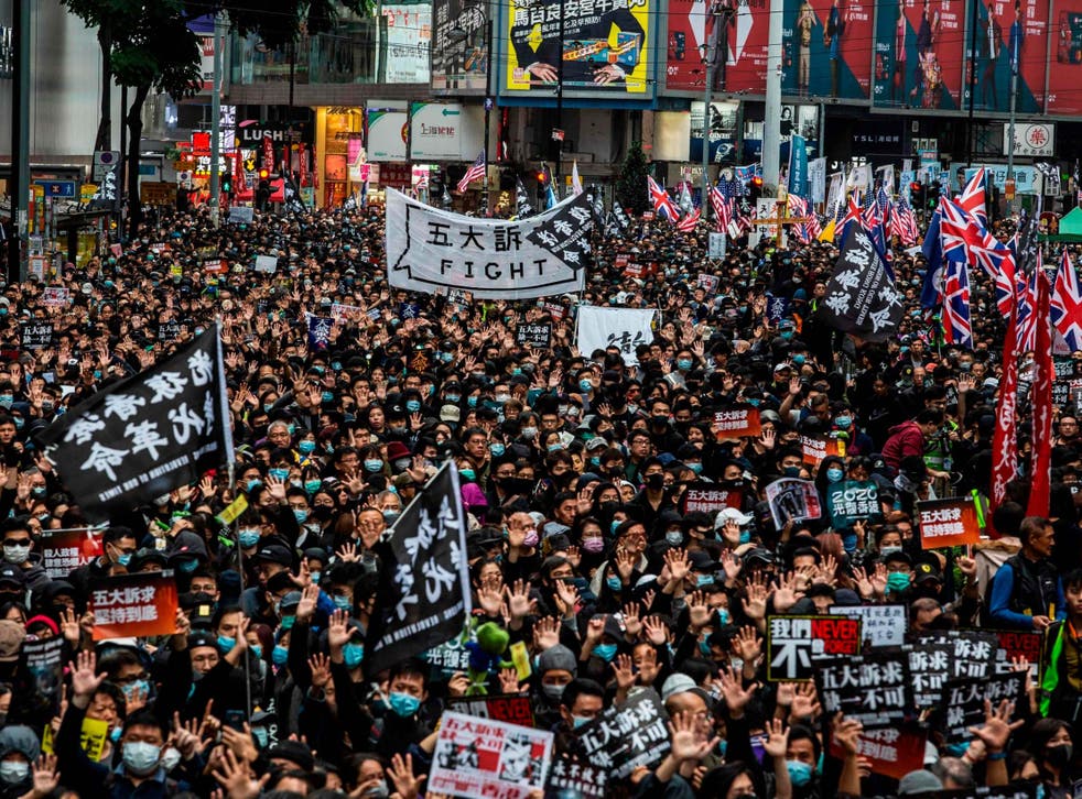 Protesters march in Hong Kong for a pro-democracy rally on 1 January 2020