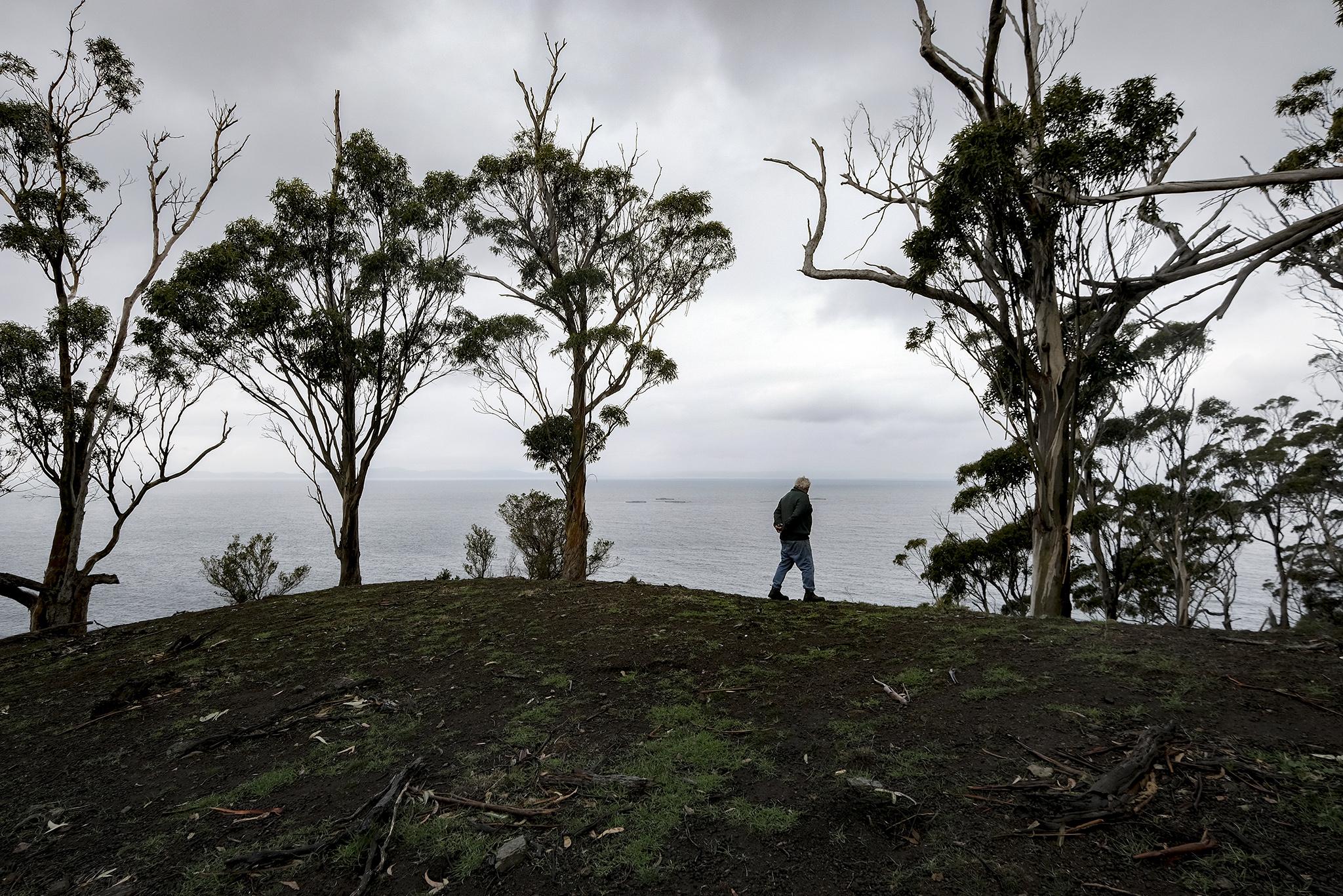 Rodney Dillon, 63, walks the coastline on indigenous land in Bruny Island, Tasmania