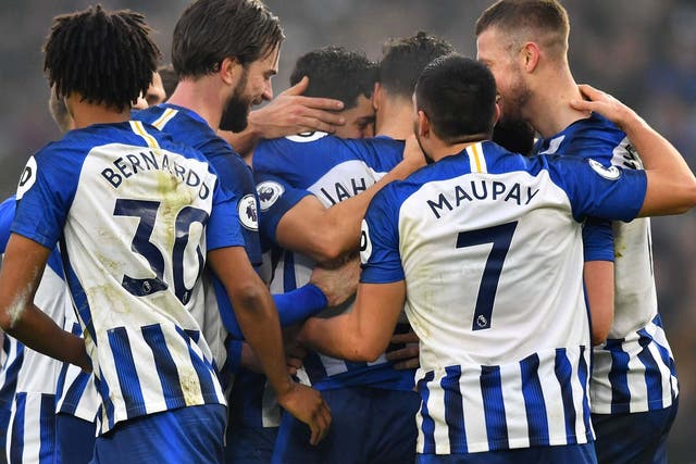 Brighton's players celebrate after grabbing an equaliser 