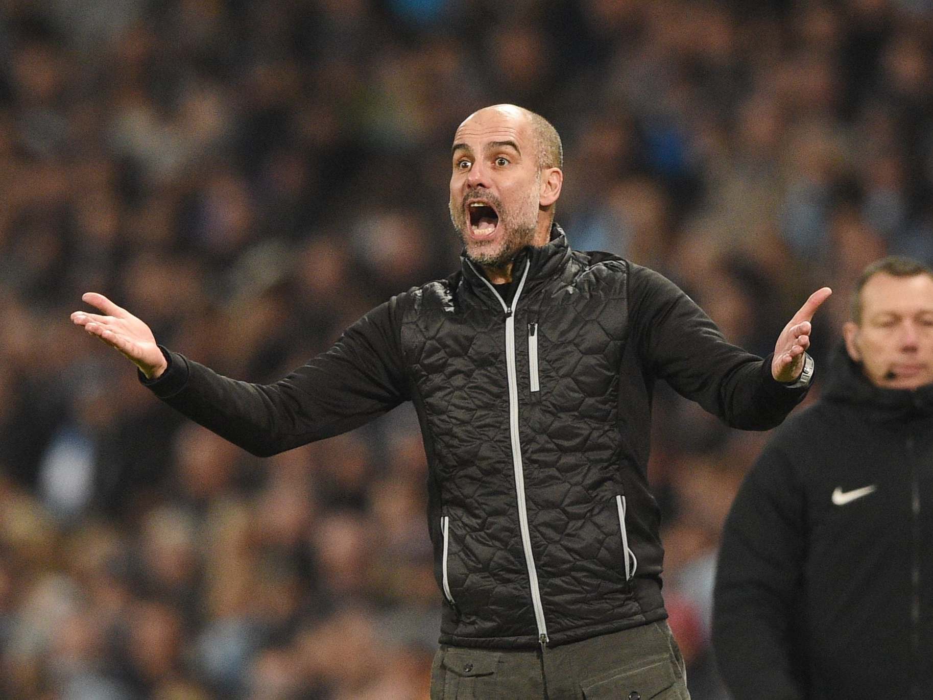 Manchester City's Pep Guardiola gestures on the touchline