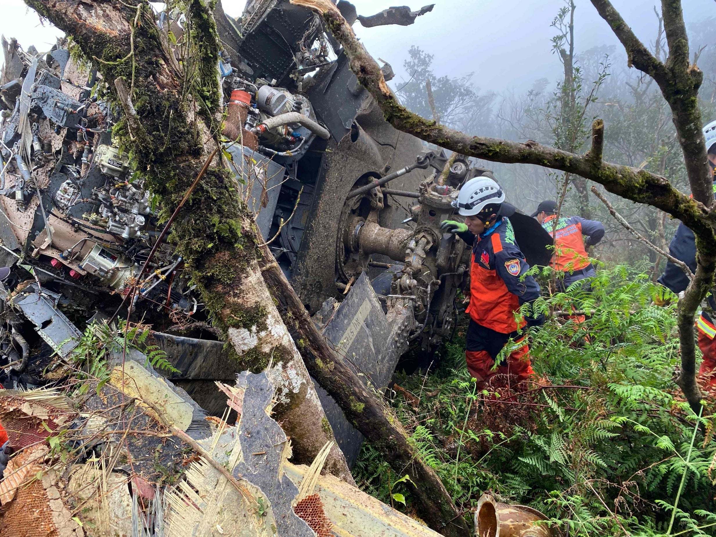 Rescuers search for survivors after a military Black Hawk helicopter crashed in mountains near Taipei, in Taiwan, killing eight people, 2 January, 2020.