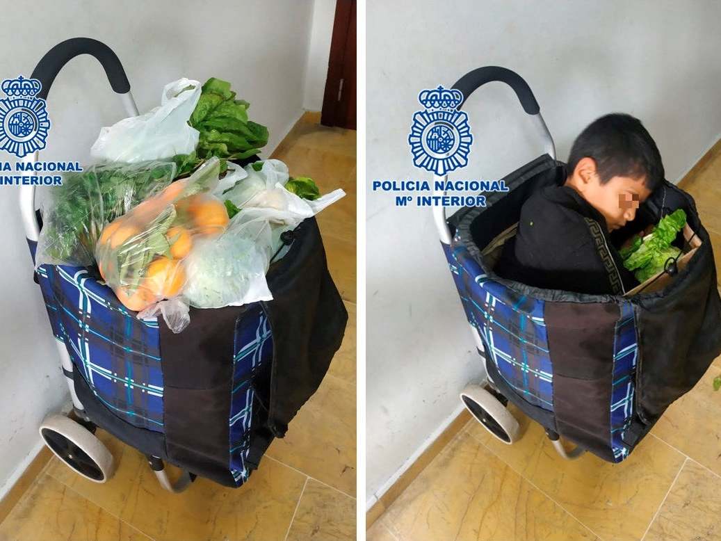 A photo from Spanish police shows how the boy was curled up in the trolley