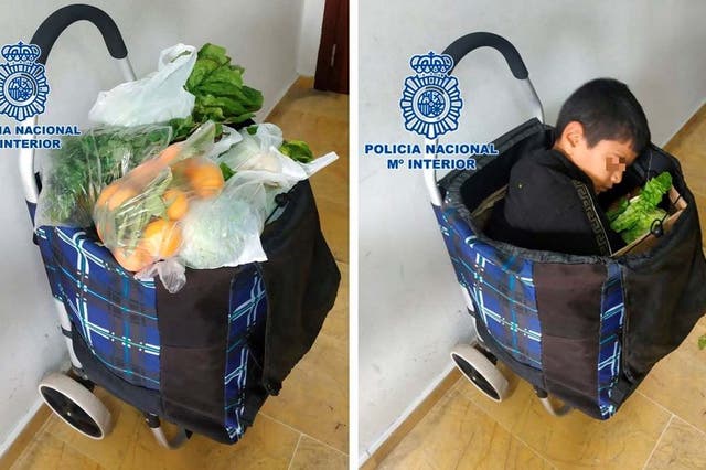 A photo from Spanish police shows how the boy was curled up in the trolley