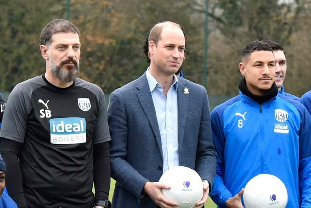 The Duke of Cambridge (centre) with members of the first team of West Bromwich Albion FC, on a visit as part of the Heads Up campaign on 28 November 2019