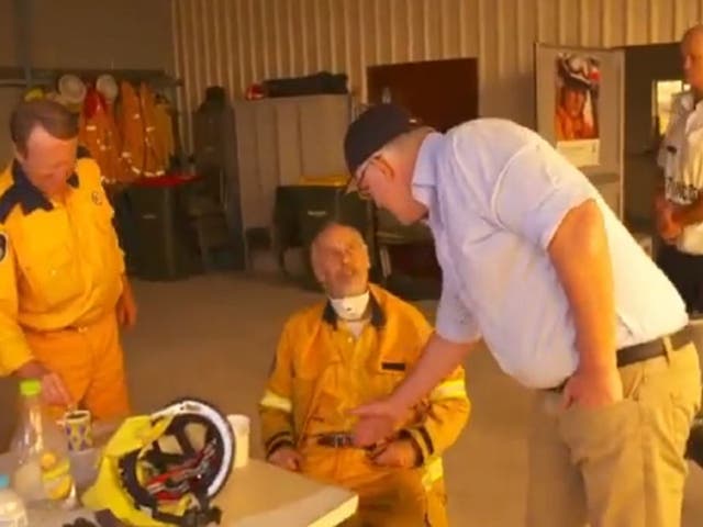 An unidentified firefighter was caught on camera refusing to shake Australian prime minister Scott Morrison's hand in Cobargo, New South Wales, Australia, 2 January, 2020.