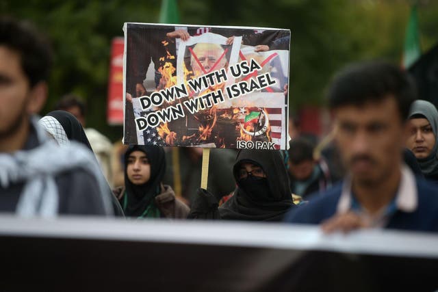 Protesters shout slogans against the United States during a demonstration following a US airstrike that killed top Iranian commander Qasem Soleimani in Iraq, in Islamabad on January 3, 2020