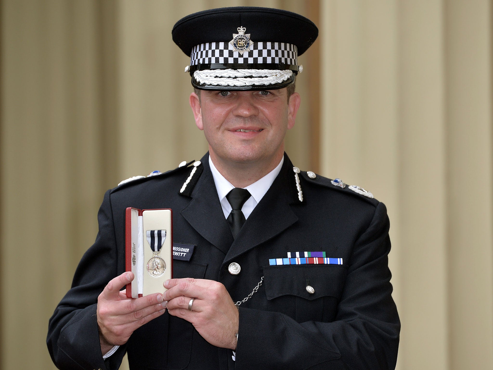 Martin Hewitt, then assistant commissioner of the Met Police, with his Queen’s Police Medal in 2014 (WPA Pool/Getty)