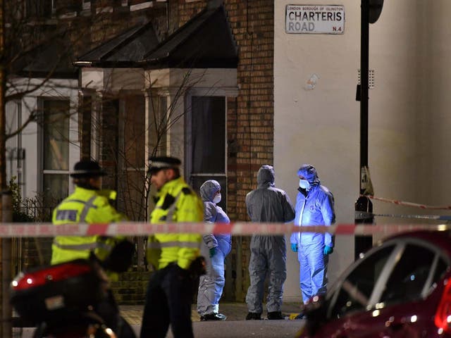 Forensic officers at the crime scene in Finsbury Park after a man was stabbed to death on Friday evening