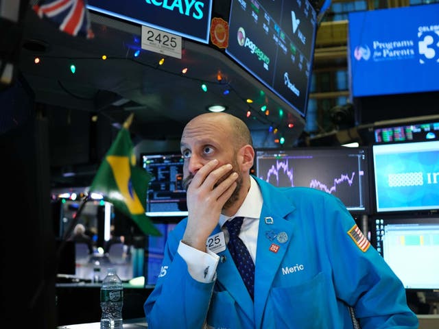 Traders work on the floor of the New York Stock Exchange (NYSE) on 3 January 2020