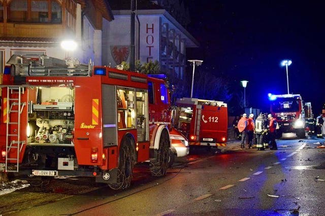 Emergency responders at the scene where six people were killed by a drunk driver in the Italian town of Luttach