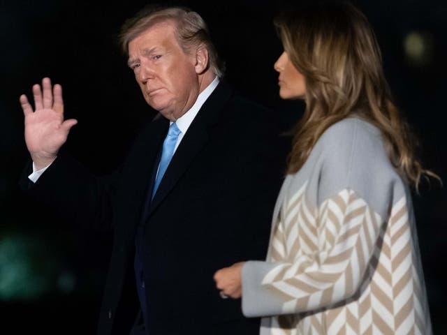 US president Donald Trump and first lady Melania Trump walk across the South Lawn of the White House after returning to Washington from their Christmas break on 5 January 2020